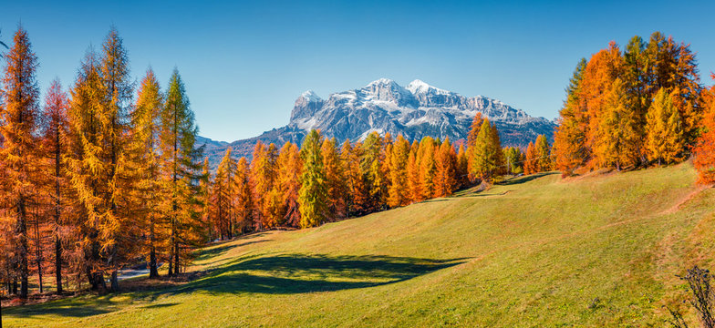 Breathtaking  morning panorama of Italian Alps. Sunny autumn scene of Dolomite mountains, Cortina d'Ampezzo location, Italy, Europe. Beauty of nature concept background.