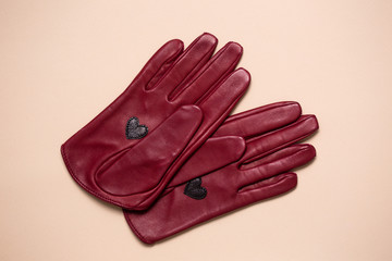 burgundy leather gloves with a heart on the palm