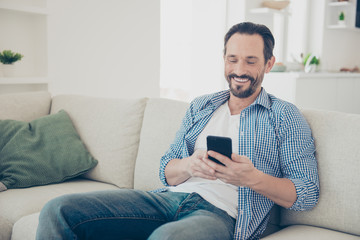 Optimist grinning careless carefree brunet hair man in checkered