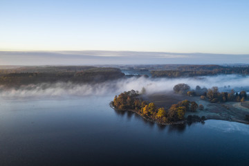 Morning mist on the banks of big lake