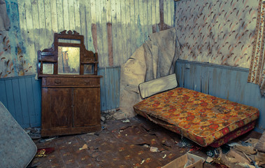 Creepy derelict bedroom in an old abandoned house, vintage coulor cross processed style,
