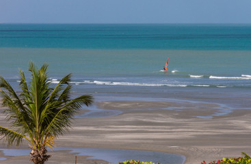 Jericoacoara Beach, Ceara, Brazil, January 15 2018 - View beach, stunning blue-green sea, and Windsurf