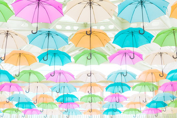 Fototapeta na wymiar Colorful umbrellas displayed in shopping mall