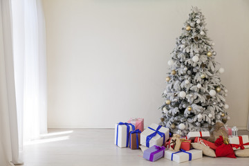Christmas tree with presents, lights new year winter holidays