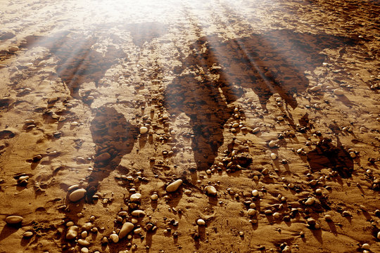 conceptual environmental image of world map and dirt land with rocks. NASA world map image layered and used; www.nasa.gov , https://www.flickr.com/photos/gsfc/sets/72157632172101342