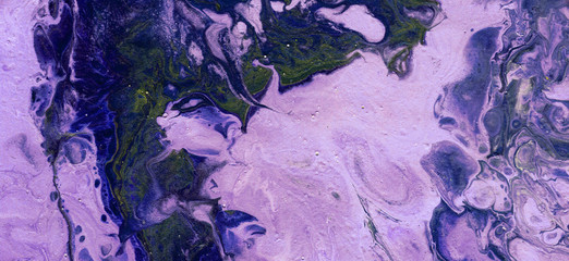 Beautiful textural background. Light violet paint flows in a deep blue color with the addition of yellow-green paint. The style includes curls of marble or pulsations of agate with bubbles and cells.