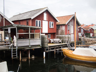 Fototapeta na wymiar Port of Smogen Sweden Fishingboat Details Red Fisher Hut