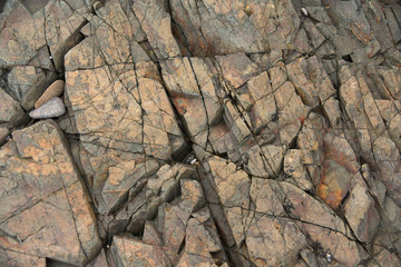 Natural stone background with cracks.