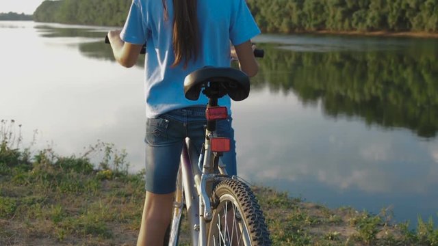 A child on a bike enjoys freedom. Cyclist on vacation.