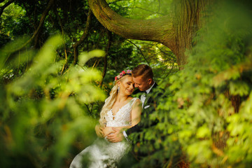 Beautiful Wedding couple posing in nature