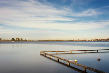 Fototapeta premium View on the Loosdrechtse plassen, the Netherlands. An area with several connected beautiful lakes, Ideal for boating, swimming, aquatics, relaxing and enjoying a waterrich environment