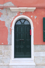 Door with ruined facade
