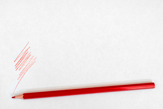 Red Pencil Writes On White Paper.