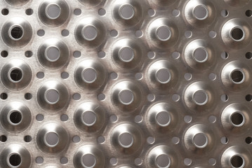 Metal textured background with perforated holes