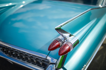 Detail of old timer, turquoise Cadillac