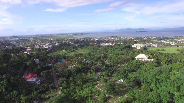 Los Ba&ntilde;os, Laguna, Philippines - November 21, 2017: Mountain rainforest modern housing built. Drone Aerial