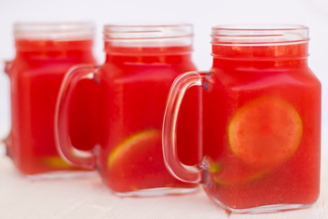 Homemade lemonade from watermelon and lemon in glass cups on a light background