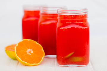 Fototapeta na wymiar Homemade lemonade from watermelon and lemon in glass cups on a light background