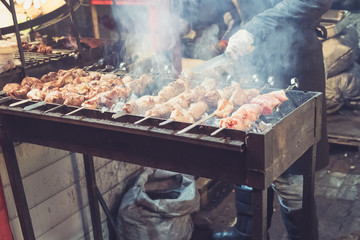 Hot food at the festival of street fast food, sausages, hot dog, fried meat