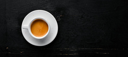 Espresso coffee On a wooden background. Top view. Free copy space.