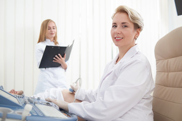 Doctor looking at camera while diagnosing patient.
