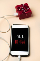 gift and text happy cyber monday in a smartphone
