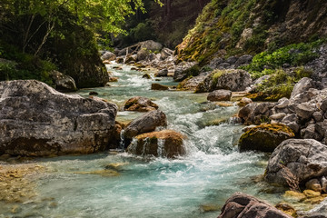 Scenic blue water river flowing between rocks in Triglav National Park, Slovenia