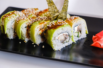 Sushi roll with eel and avocado. Japanese food.