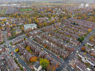 Aerial photo of a typical town in the UK showing rows of houses, paths & roads, taken over...