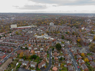 Obraz premium Aerial photo of a typical town in the UK showing rows of houses, paths & roads, taken over Headingley in Leeds, which is in West Yorkshire in the UK.