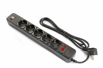 Black plastic power strip with 6 electrical outlets and USB charger ports