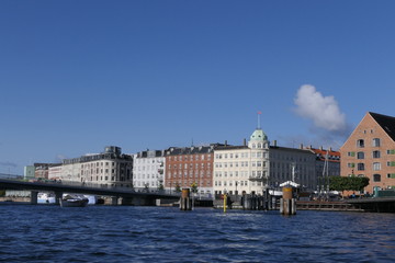 Panoramic view of a canal of Copenhagen with houses and a pedestrian bridge, Denmark