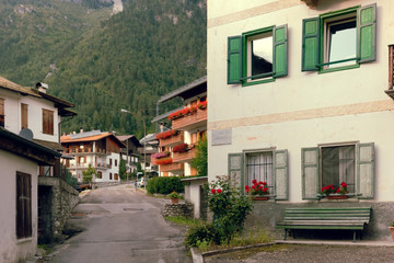 Fototapeta na wymiar Beluno, Italy August 9, 2018: Auronzo di Cadore mountain village. Houses on the mountains.