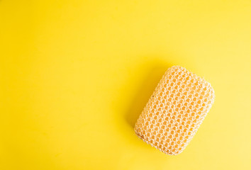sponge with esparto to exfoliate in bathroom