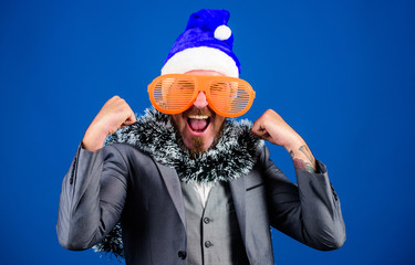 Manager tinsel ready celebrate new year. Corporate holiday party ideas employees will love. Christmas party office. Corporate christmas party. Man bearded hipster wear santa hat and funny sunglasses