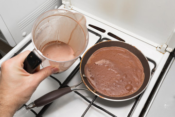 Cooking chocolate pancakes with help of chocolate batter