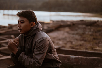 asian young man enjoying the cold morning