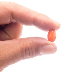 Vitamin Rice Bran Oil , Orange pills on hand.