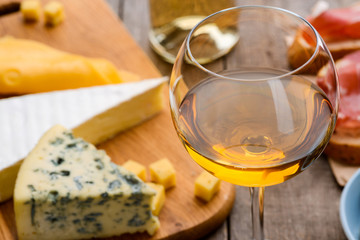 White wine and different cheeses