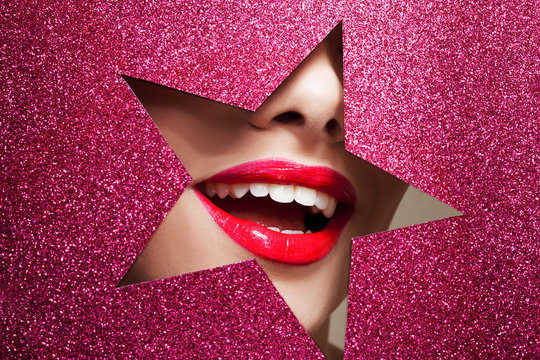 Bright makeup and you're a star. Beautiful girl close up, paper in the shape of a star