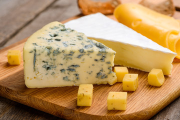Cheese variety on cutting board