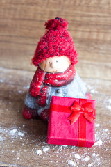 Christmas doll, space for copy. A doll in a red hat.