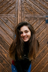 Fototapeta premium Beautiful girl in a leather jacket in the old place