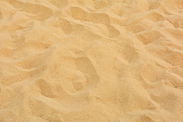 closeup of sand pattern of a beach in the summer
