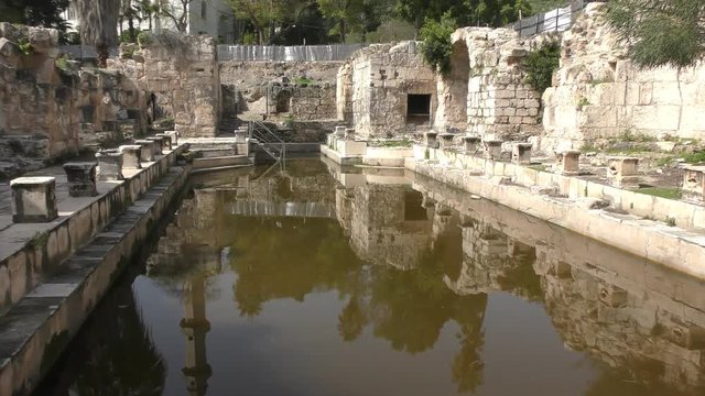 Ruins of Roman baths hot springs spa in Hamat Gader in the South of Golan Heights, view to north, pan L to R
