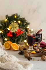 Fototapeta na wymiar Christmas red mulled wine in glass on wood board at white background