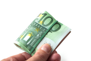 closeup of banknotes bundle of hundred euros money in hand on white background