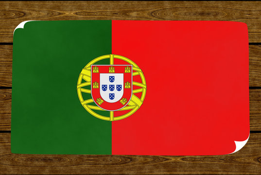 Illustration of a Portugal flag painted on the papier pasted on the woody wall
