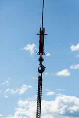 Silhouette of crane hook with chain