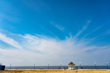 Fototapeta premium view of beach with blue sky and clouds